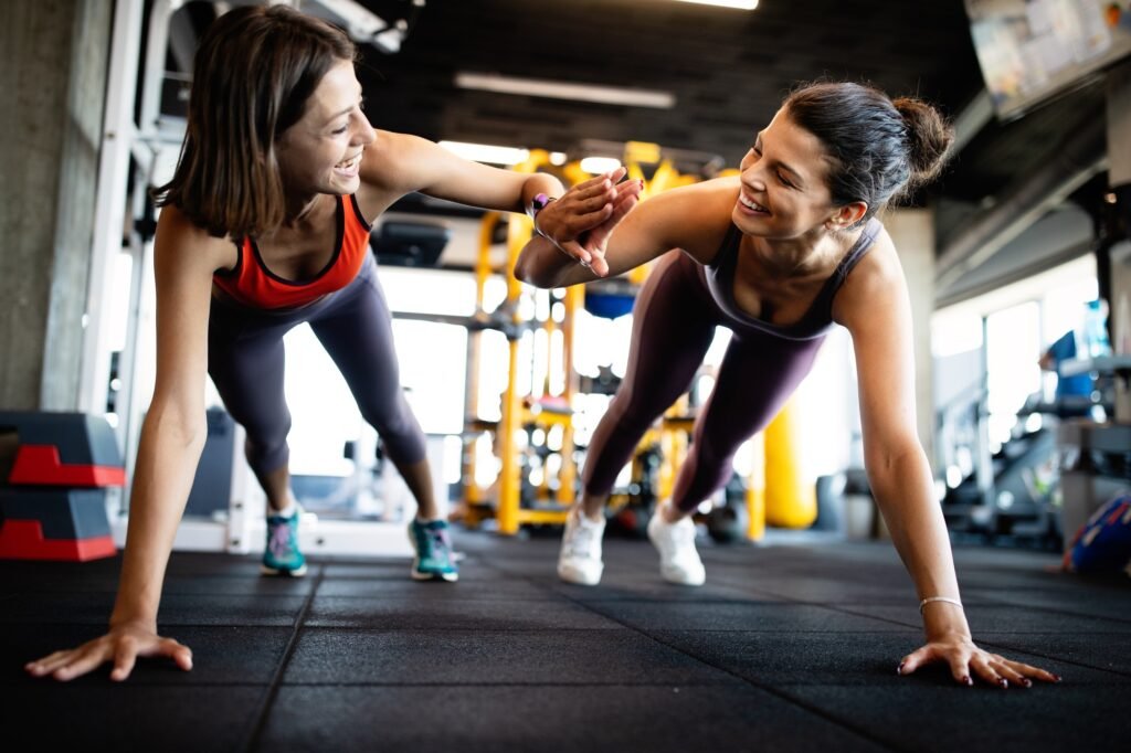 Beautiful fit women working out in gym