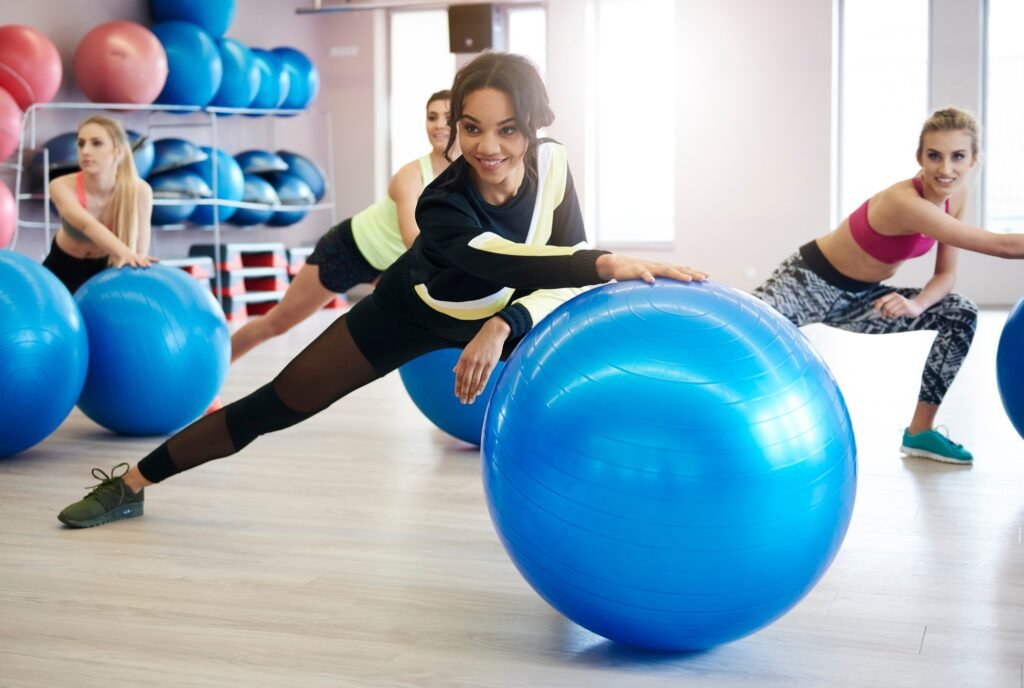 Women exercising with fitness ball